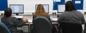 Women in a prison IT lesson