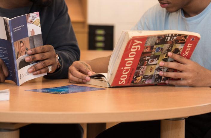 Learner with Sociology textbook