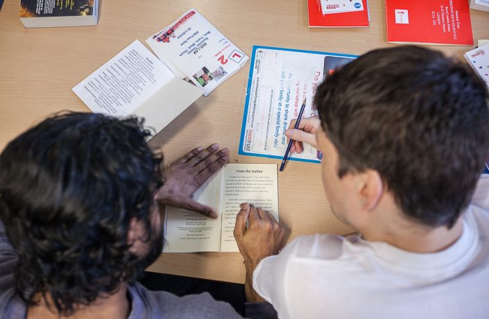 Two learners studying together in prison