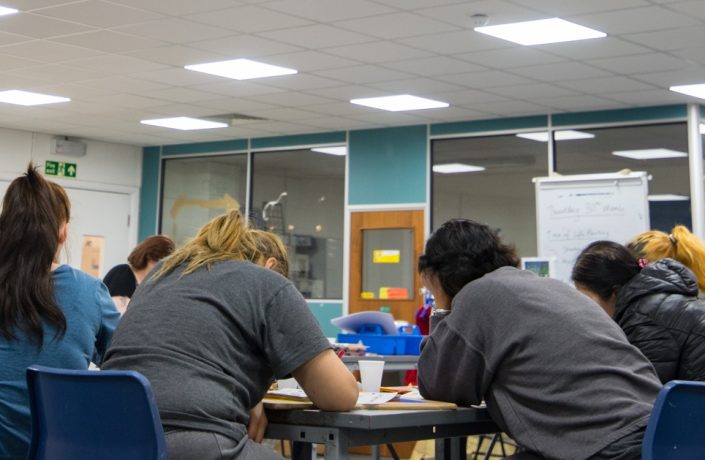 Learners in a prison classroom.